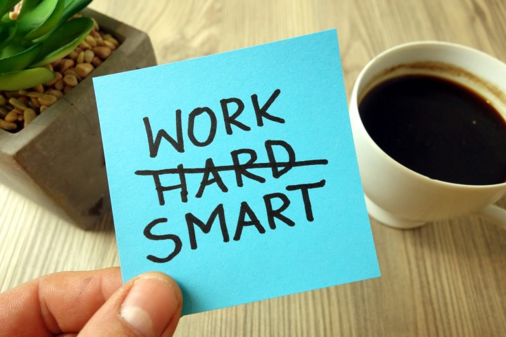 work smart motivational reminder handwritten on sticky note