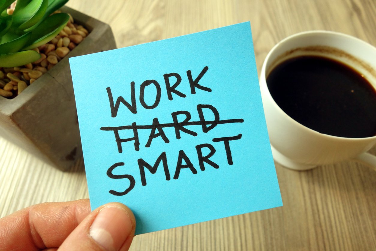 work smart motivational reminder handwritten on sticky note